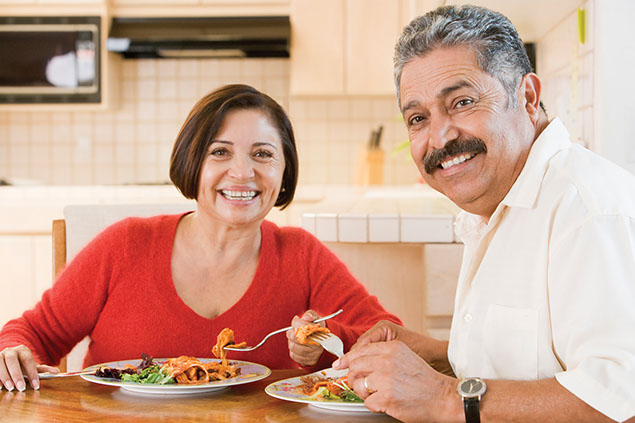 Image of couple eating dinner.
