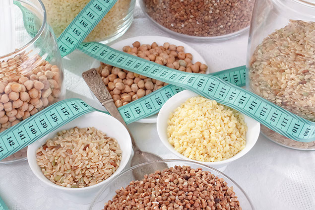 Image of different grains in bowls and jars.