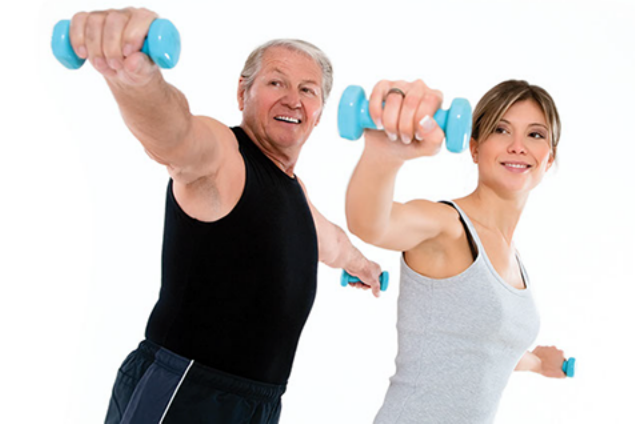 Image of couple using dumb bells.