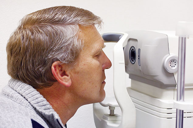Image of older man getting an eye exam.