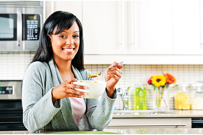 Image of women eating out of a bowl.