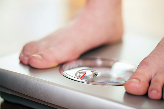 Image of feet on a scale.