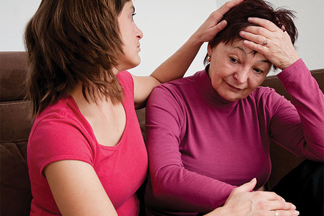 Image of women supporting another women with depression.