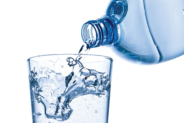 Image of a water bottle being poured into a glass.