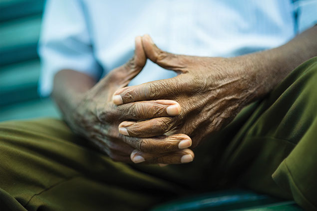 Close up image of hands joined together.