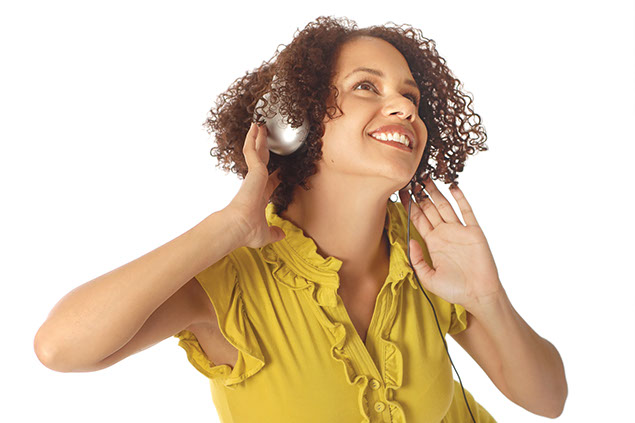 Image of women listening to head phones while dancing.