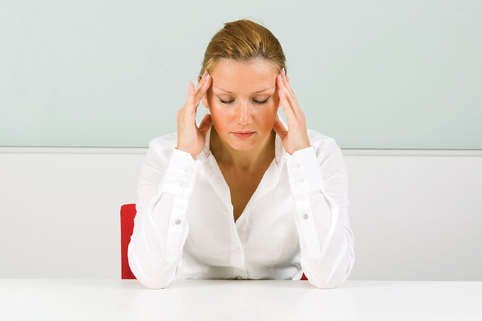 Image of women holding the sides of your forehead.
