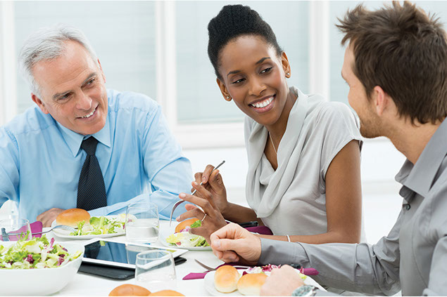 Image of co-workers having lunch.