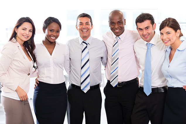 Image of a group of co-workers smiling.