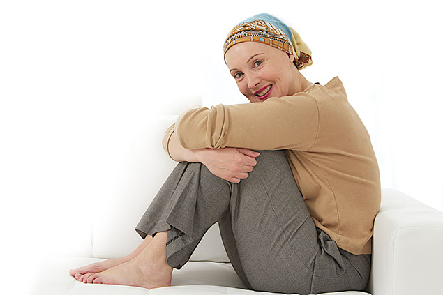 Image of women with cancer sitting on the couch.
