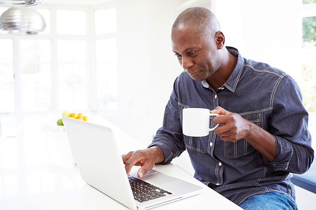 Image of man drinking a cup of coffee.