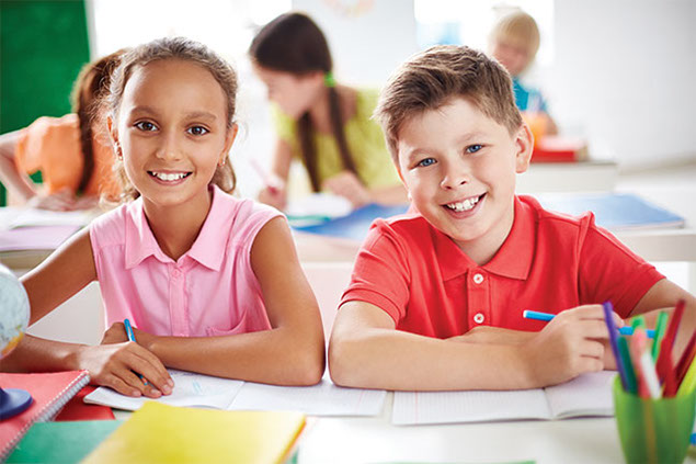 Image of 2 school kids in the classroom.