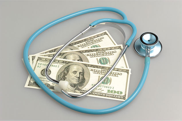 Image of money and a stethoscope.