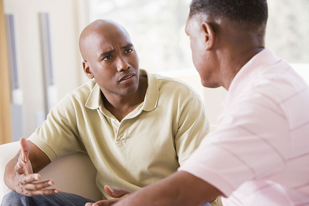 Image of 2 men talking.