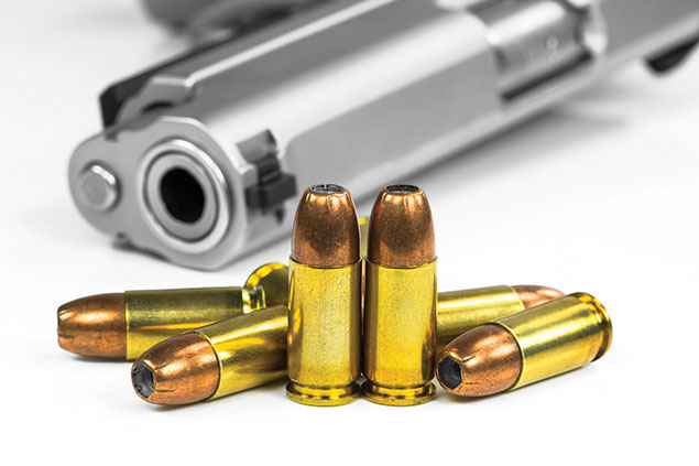 Image of gun and bullets.