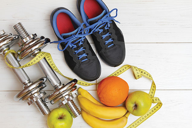 Image of athletic shoes, weight, and fruits.
