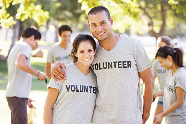 Image of volunteers smiling.