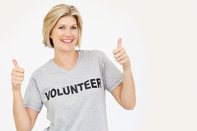 Image of female wearing a volunteer t-shirt.