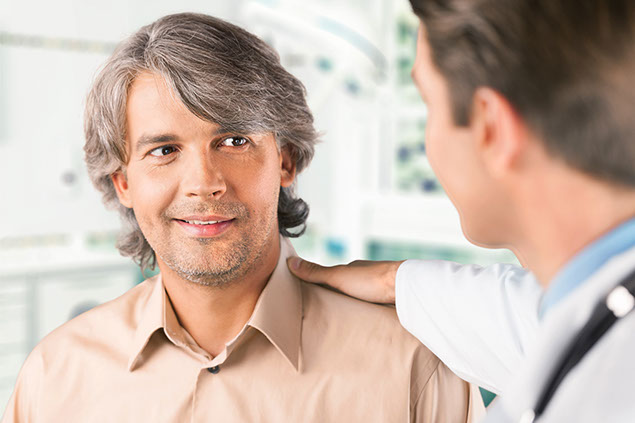 Image of man talking to his doctor.