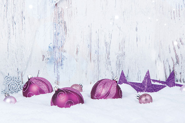 Image of ornaments in the snow.