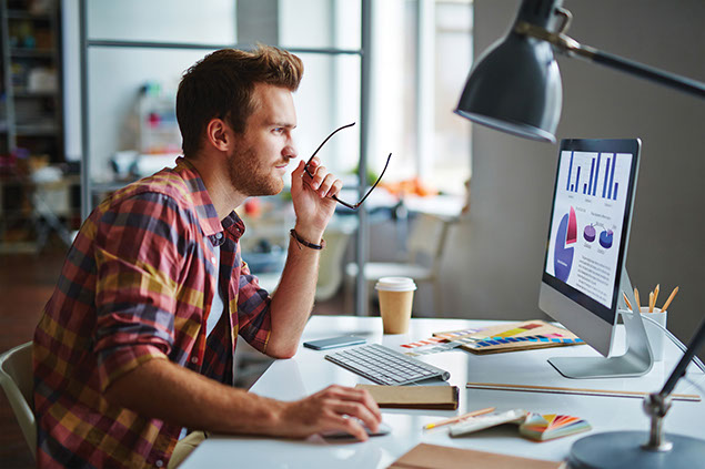 Image of man working on computer.