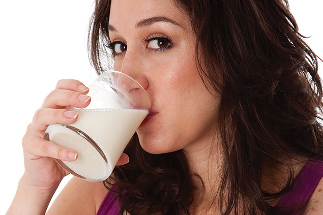 Image of women drinking a glass of milk.