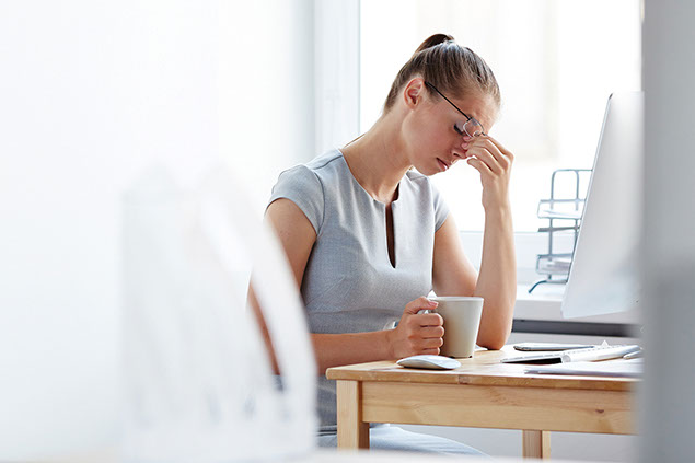 Image of stressed women at work.