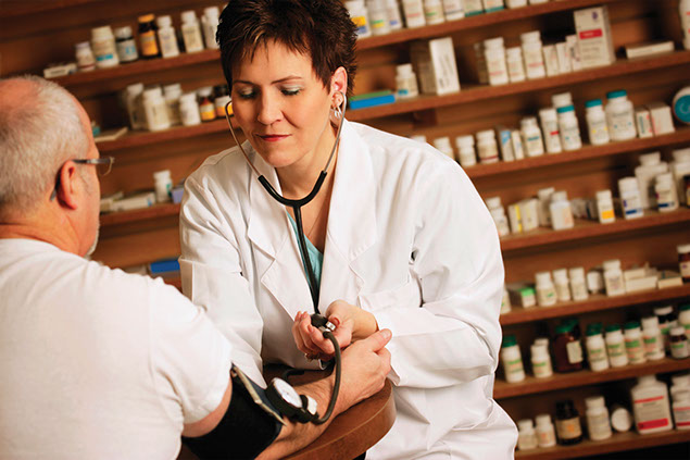 Image of doctor taking a patient's blood pressure reading.