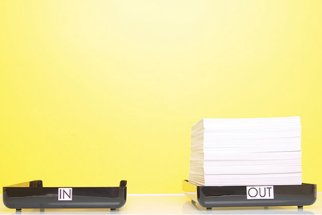 Image of an empty 'In' tray and a full 'Out' tray.