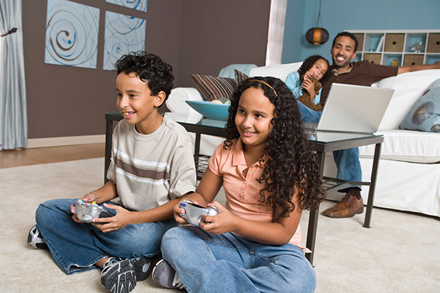 Image of two kids playing video games.