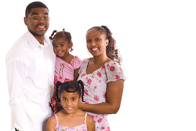 Image of young smiling family.