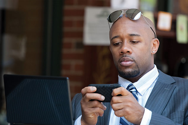 Image of man on his smart phone.