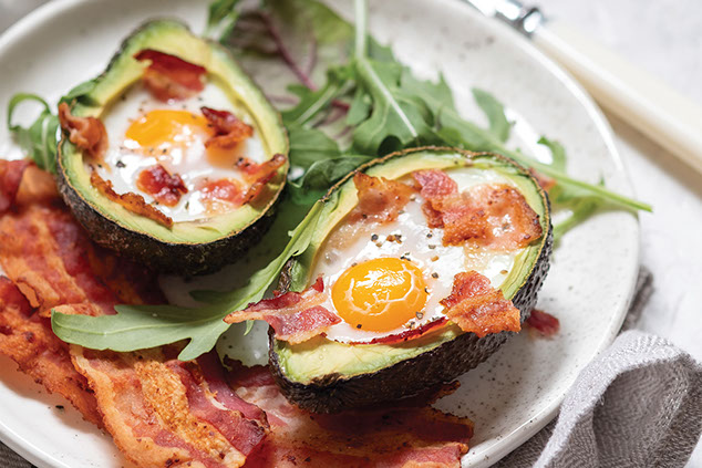 Image of avocado stuffed with eggs and bacon.
