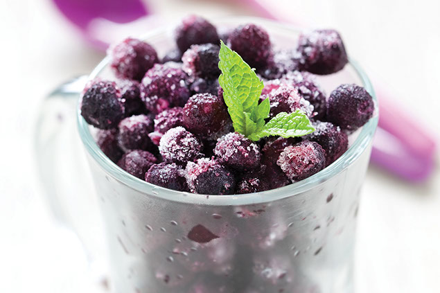 Image of frozen berries in a glass.