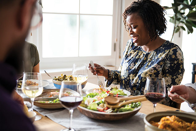 Women eating with friends.