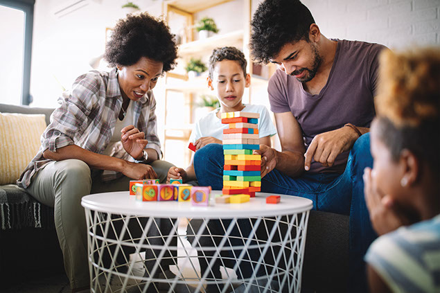 Family playing Jenga.