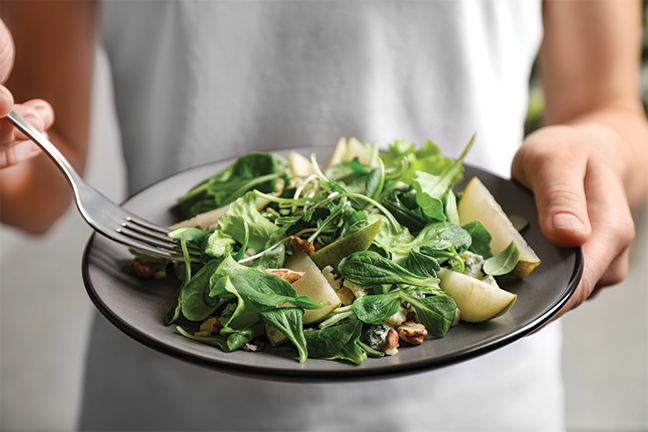 Plate of salad with pears.
