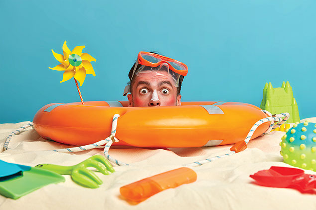 Man's sun burn face popping out of swimming tube.