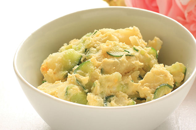 A dish filled with potato salad.