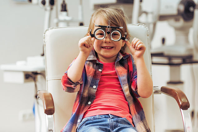 Young child at the eye doctor office.