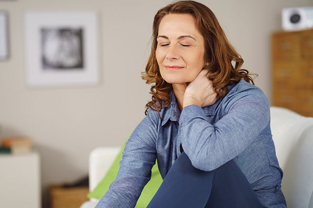 Women sitting with eyes closed and relaxed.