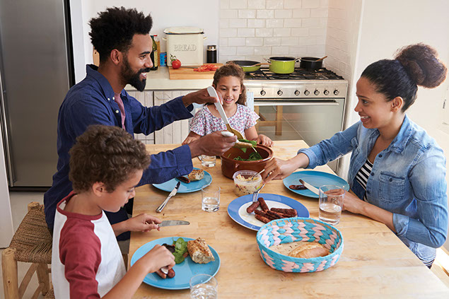 Family eating around the kitchen table.