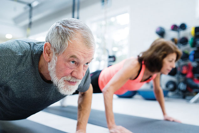 Image of man and women doing pushups.