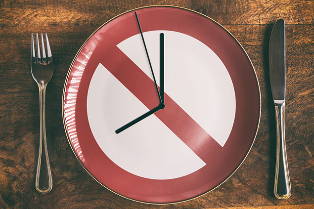 Concept image of plate with "DO NOT" sign and clock hands.