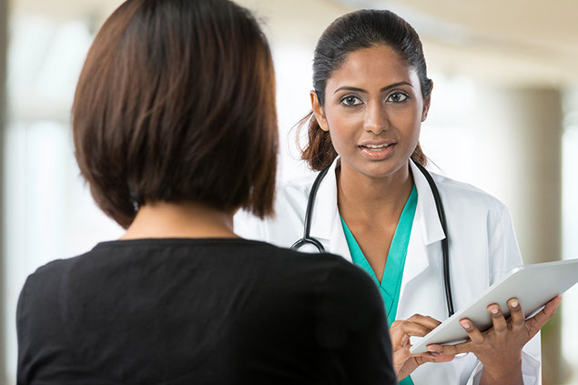 Image of doctor talking to patient.