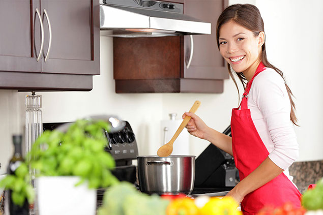 Image of women cooking in the kitchen.