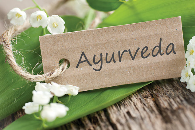 Image of leaf and tag with the word "Ayurveda"