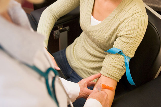 Image of patient getting blood work done.