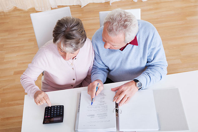 Image of couple going over budget.