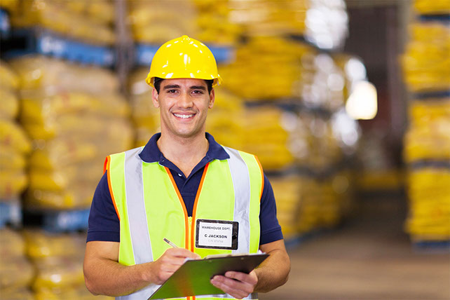 Image of worker with hard helmet on.